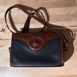 Vintage Dooney and Burke black and brown leather crossbody